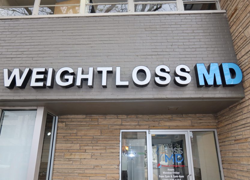 Weight Loss MD clinic exterior sign on building entrance